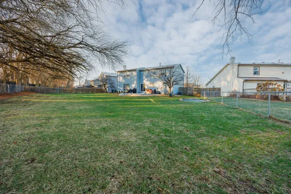 a front view of a building with a yard