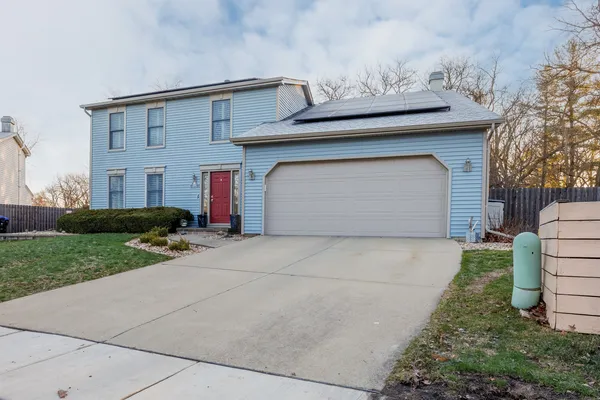 a view of a house with a back yard