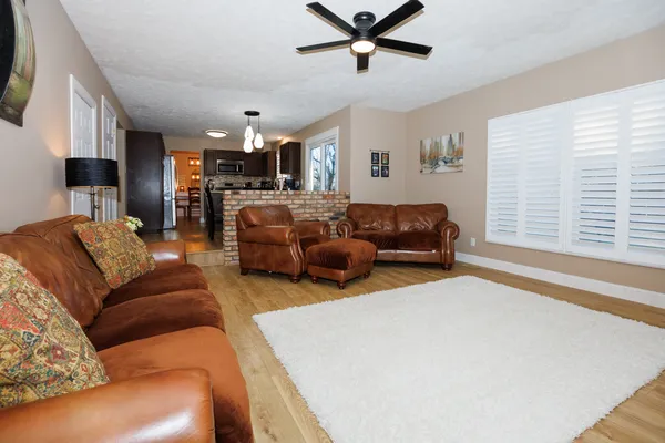 a living room with furniture and a window