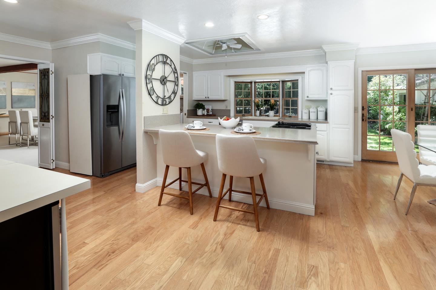 825 Parma Way Los Altos, CA 94024 - Photo 11 of 35 a dining hall with a dining table wooden floor and a large window