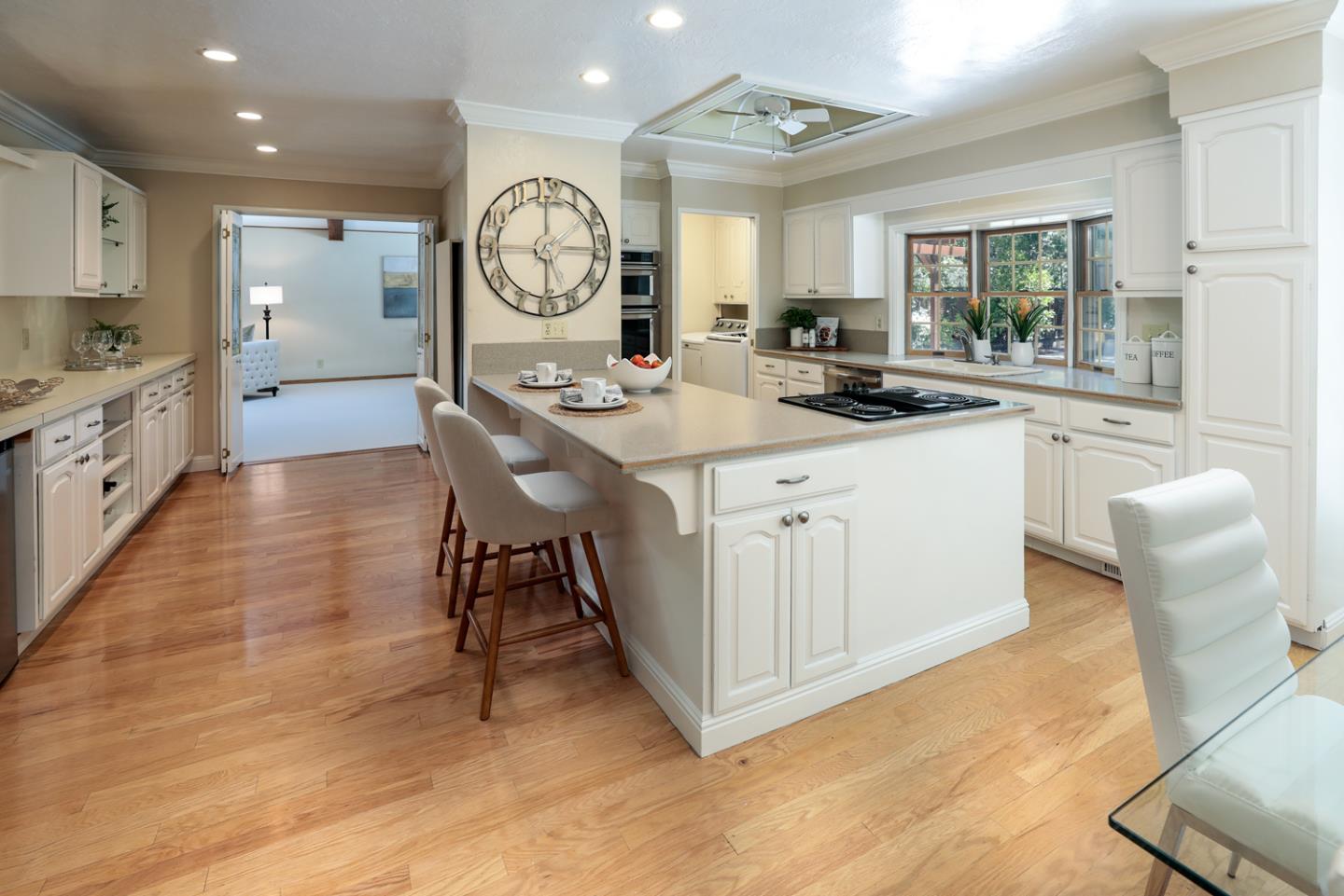 825 Parma Way Los Altos, CA 94024 - Photo 12 of 35 a large kitchen with a large window and white cabinets