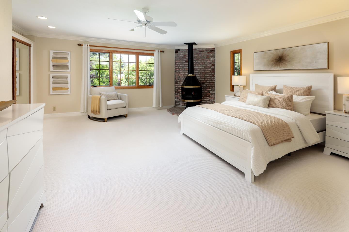 825 Parma Way Los Altos, CA 94024 - Photo 21 of 35 a spacious bedroom with a bed and a couch