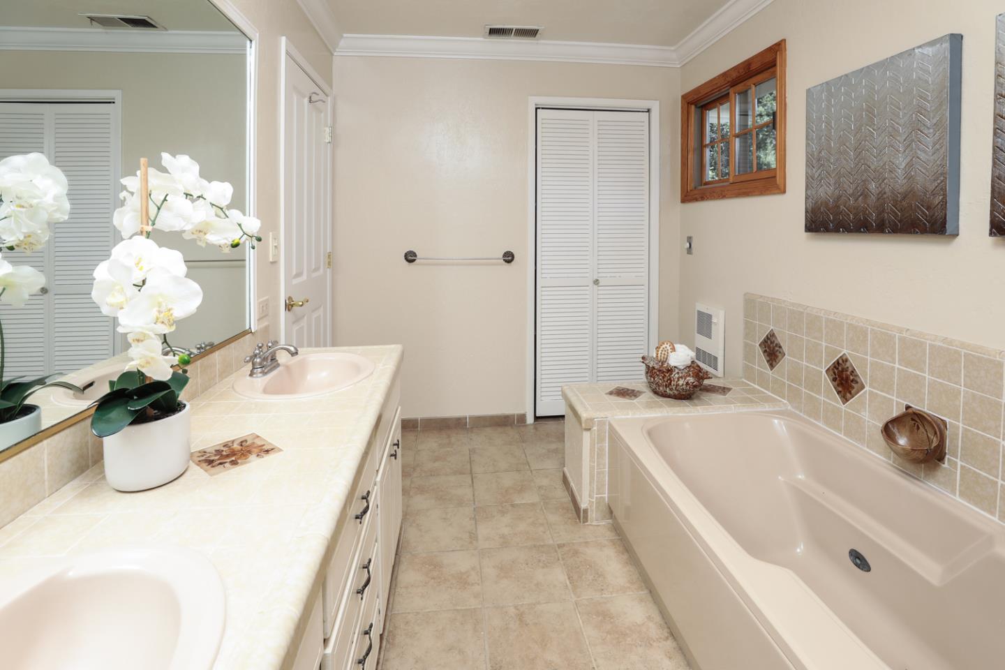 825 Parma Way Los Altos, CA 94024 - Photo 25 of 35 a bathroom with a tub sink and mirror