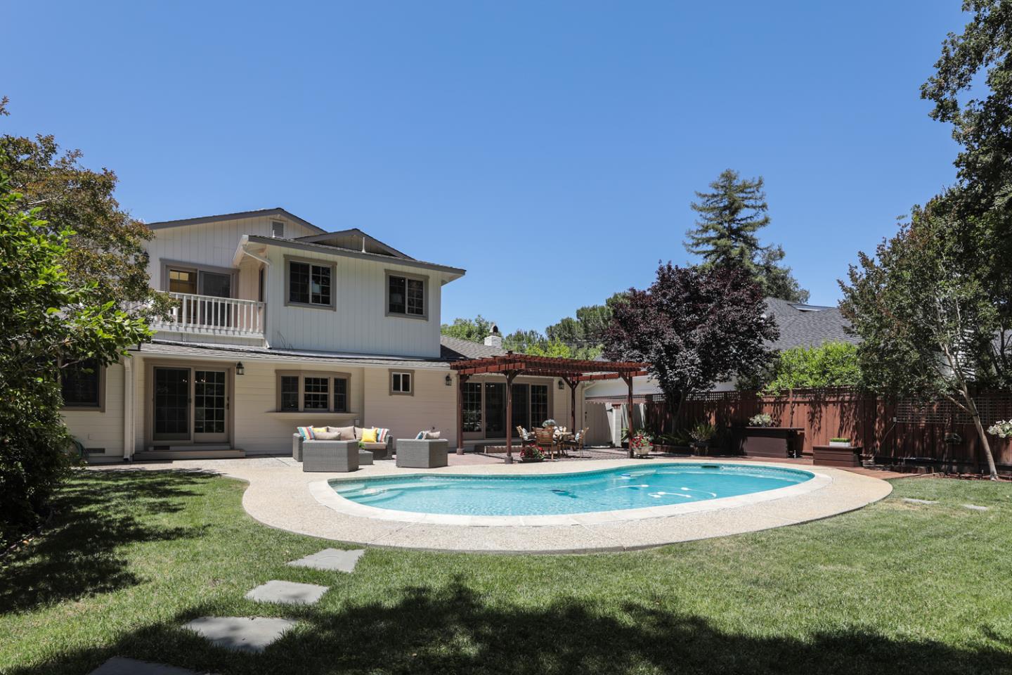 825 Parma Way Los Altos, CA 94024 - Photo 34 of 35 a view of a white house with a big yard and potted plants and large trees