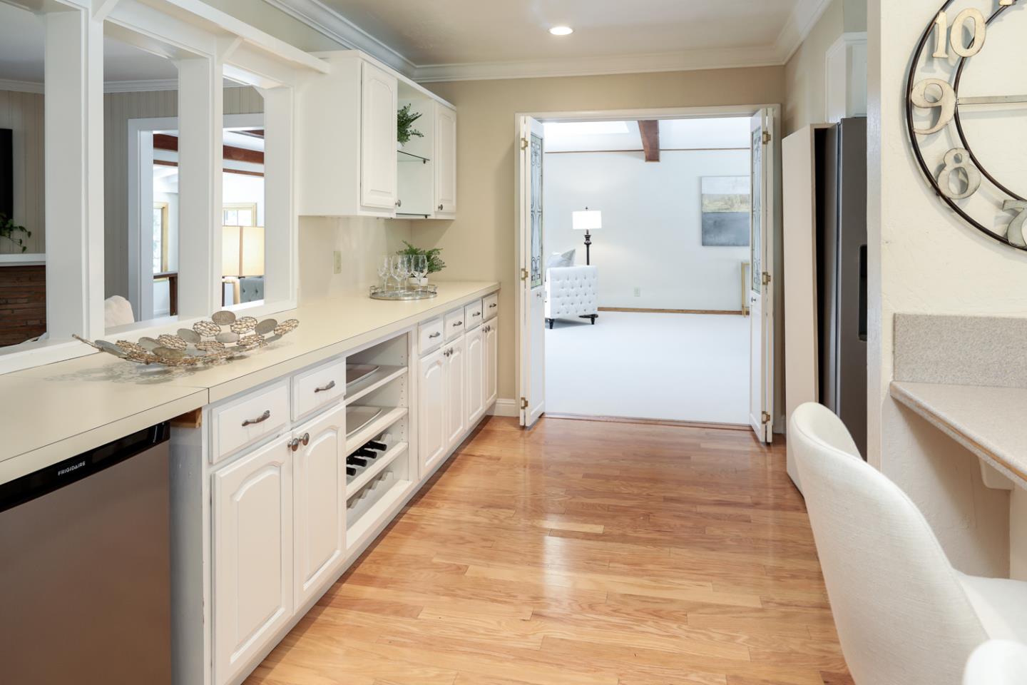825 Parma Way Los Altos, CA 94024 - Photo 10 of 35 a large white kitchen with granite countertop a sink and dishwasher with white cabinets