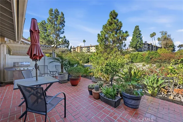 a view of a backyard with sitting area