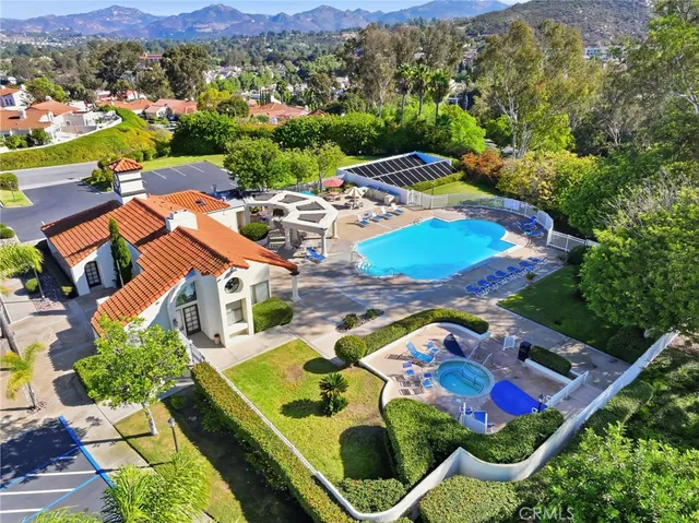 an aerial view of residential houses and outdoor space