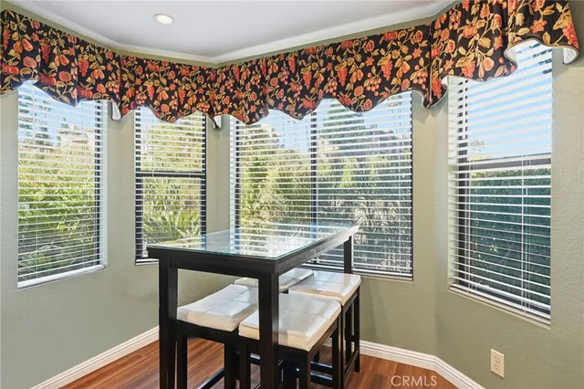 a view of a room with a table and chairs