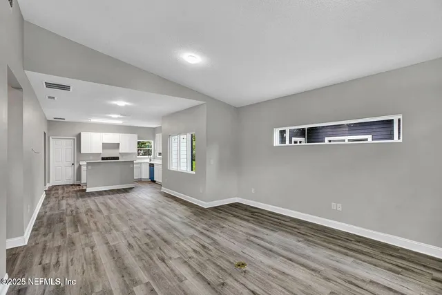 a view of a livingroom with wooden floor