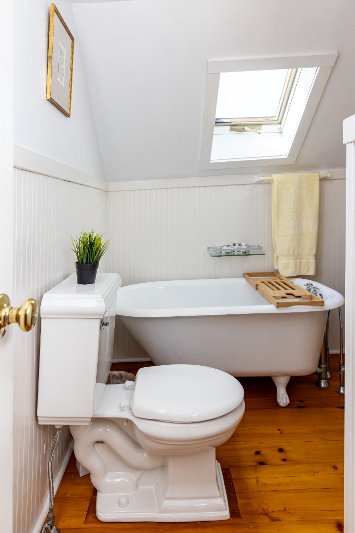 10 Danls Way West Tisbury, MA 02568 - Photo 16 of 41 a bathroom with a toilet a sink and a window