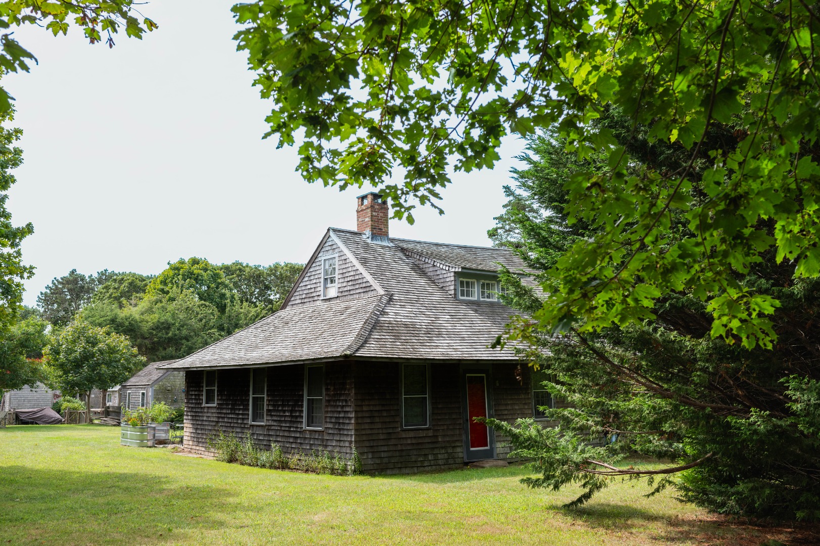 10 Danls Way West Tisbury, MA 02568 - Photo 28 of 41 a front view of a house with a garden