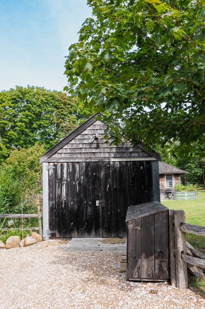10 Danls Way West Tisbury, MA 02568 - Photo 36 of 41 a backyard of a house with barbeque oven and outdoor seating