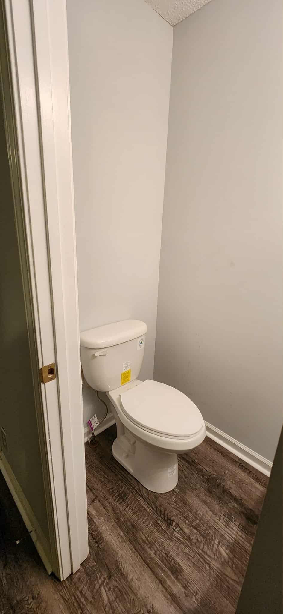 289 Raleigh Drive, Unit B Clarksville, TN 37043 - Photo 12 of 22 a white toilet sitting next to a sink