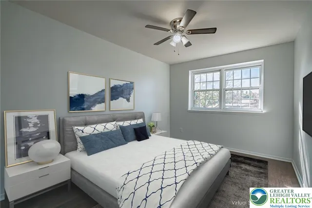 a bedroom with a large bed and a window