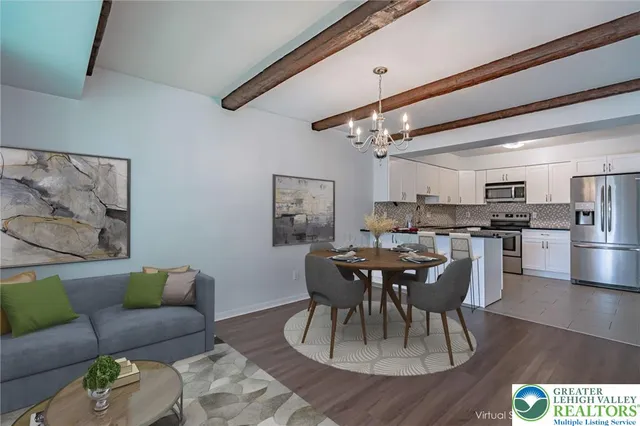 a dining room with furniture and wooden floor