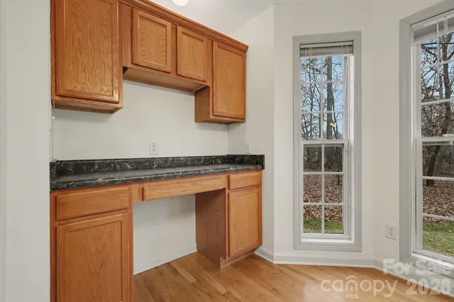 a backyard of a house with barbeque oven