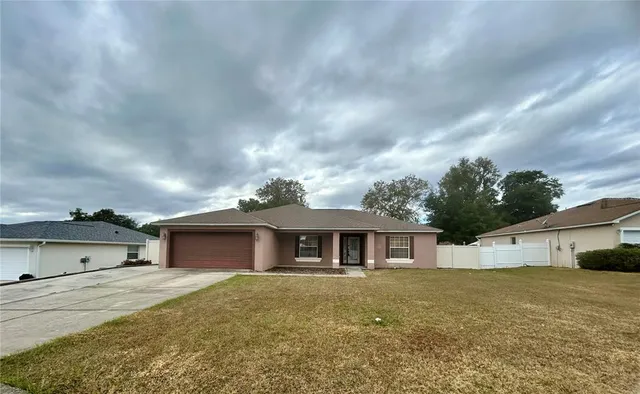 a front view of a house with a garage