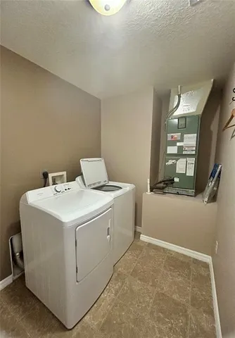 en empty room with windows and ceiling fan