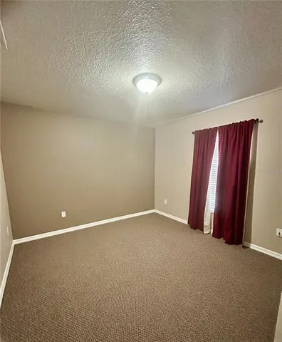 a bathroom with a tub a sink and mirror