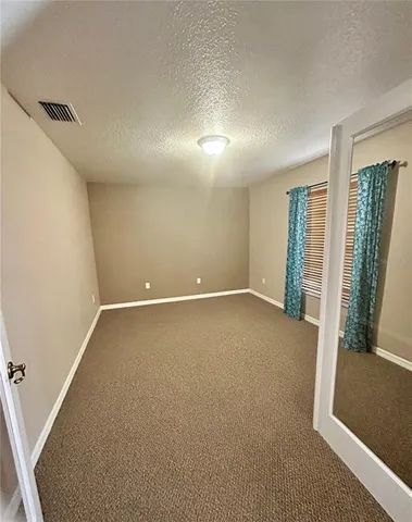 a large kitchen with cabinets and stainless steel appliances