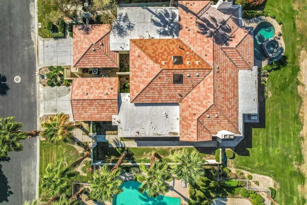 an aerial view of a house with garden
