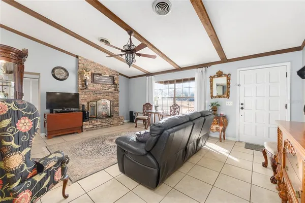 a bedroom with a bed and chair