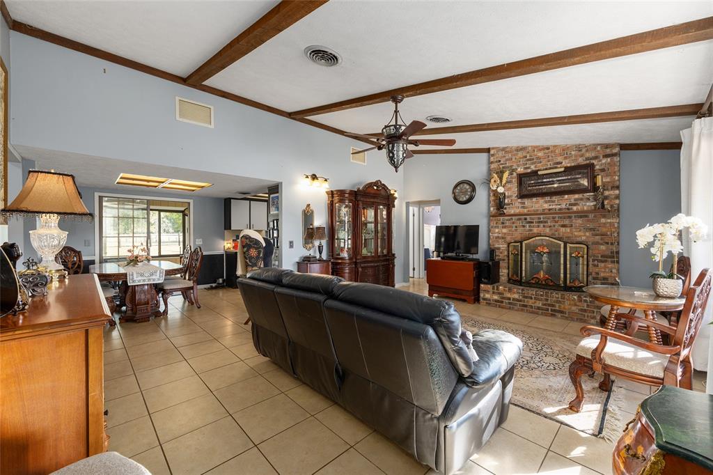 825 Northeast 165th Street Citra, FL 32113 - Photo 22 of 62 a living room with furniture and a large window