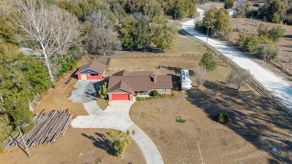 825 Northeast 165th Street Citra, FL 32113 - Photo 48 of 62 an aerial view of a house with a yard