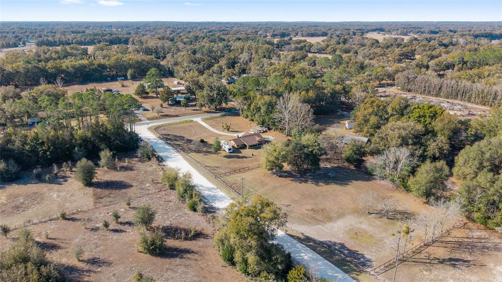 825 Northeast 165th Street Citra, FL 32113 - Photo 61 of 62 an aerial view of a house with a yard