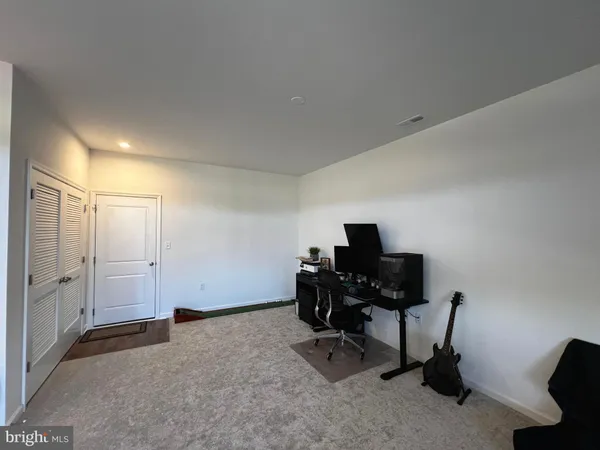 a view of a workspace with furniture