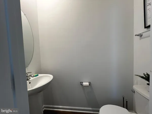 a bathroom with a sink a toilet