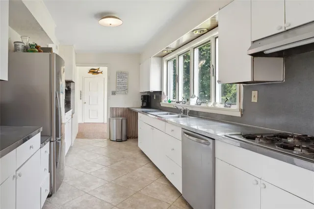 a bedroom with a bed and a mirror