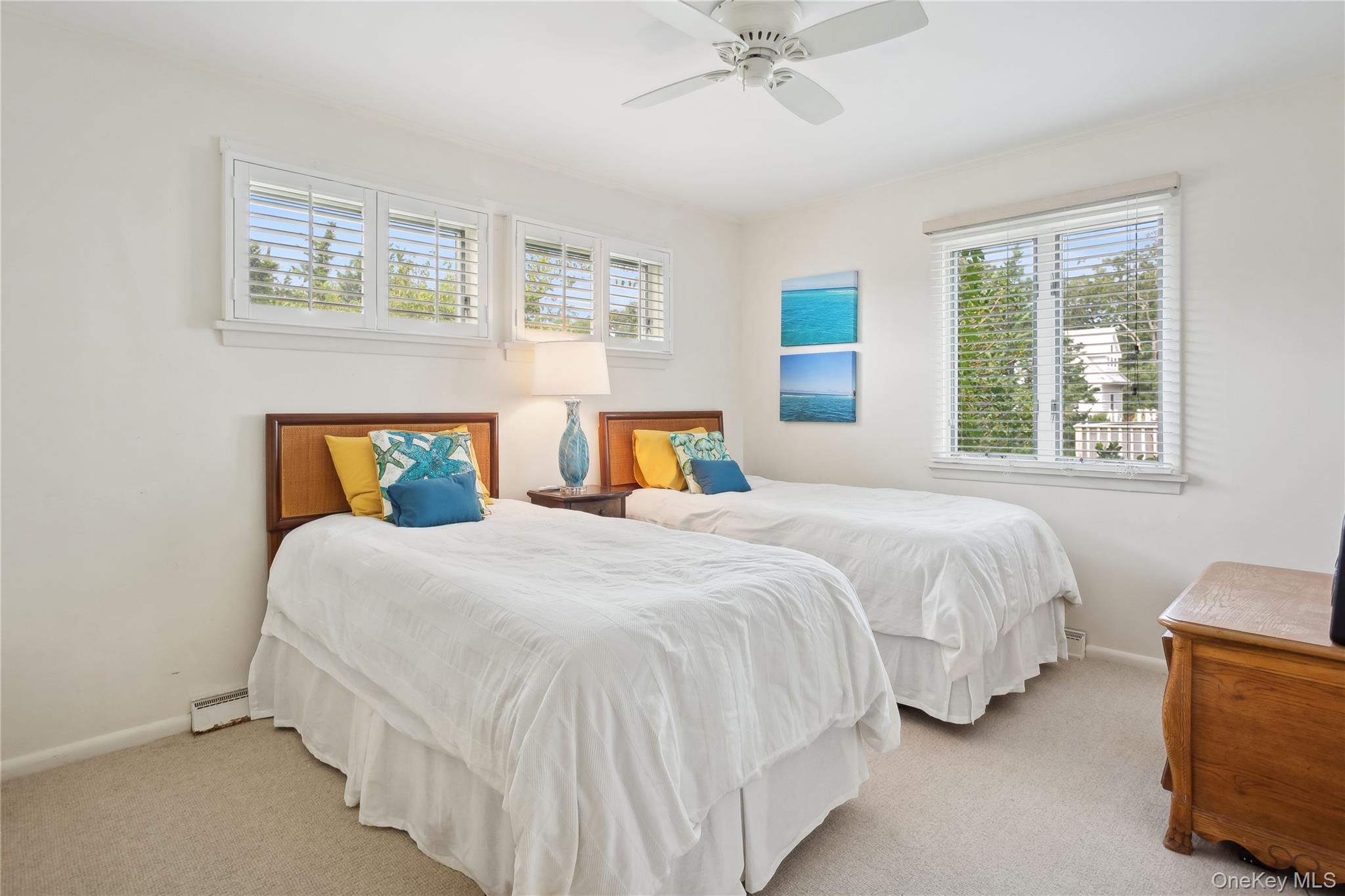 33 Beach Road Laurel, NY 11948 - Photo 14 of 38 a bedroom with bed and window