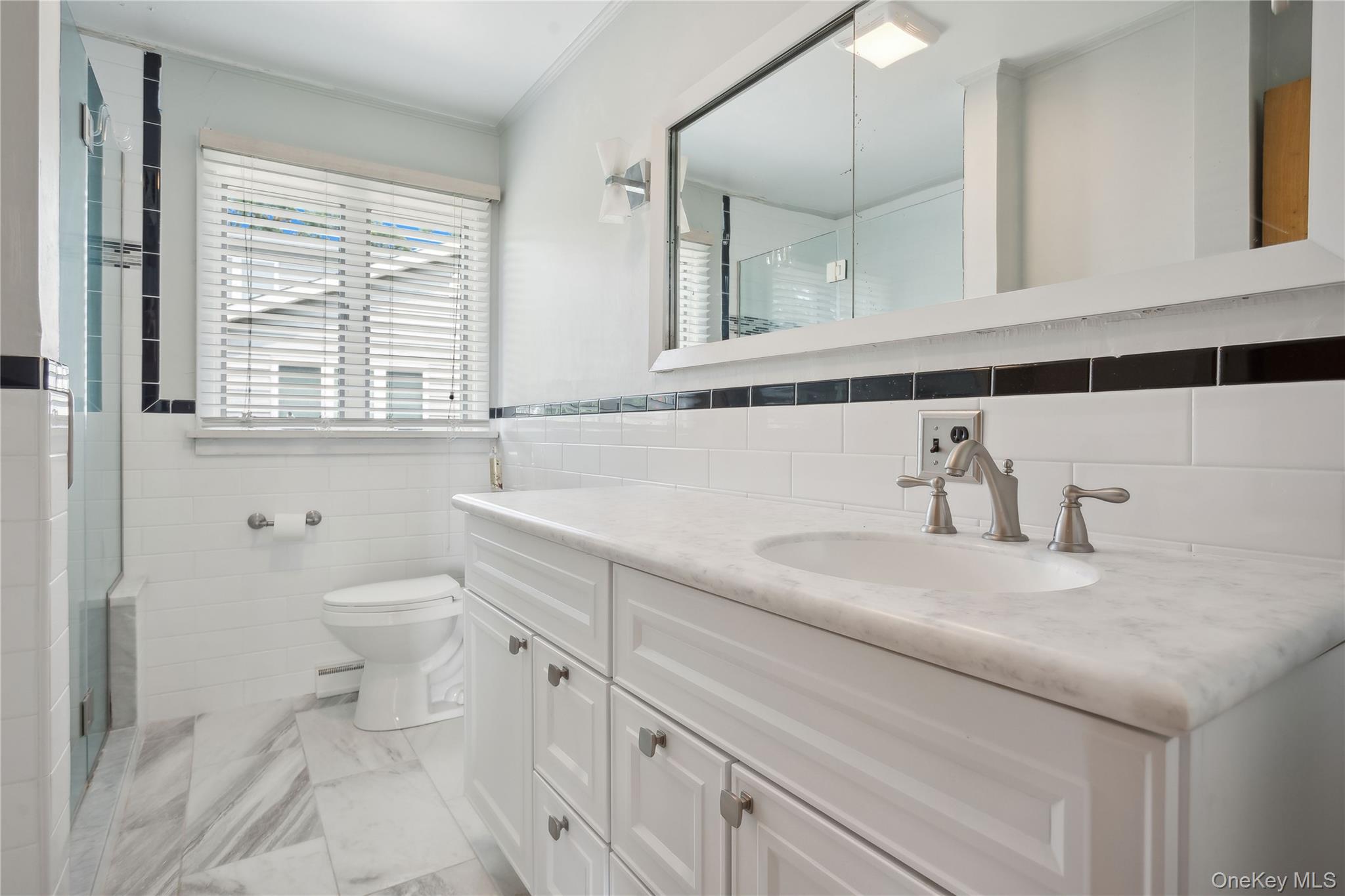 33 Beach Road Laurel, NY 11948 - Photo 16 of 38 a bathroom with a sink and a toilet