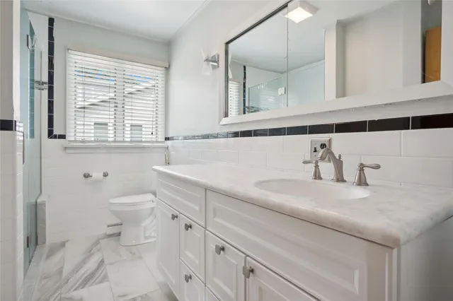 a en suite bathroom with a sink and a shower
