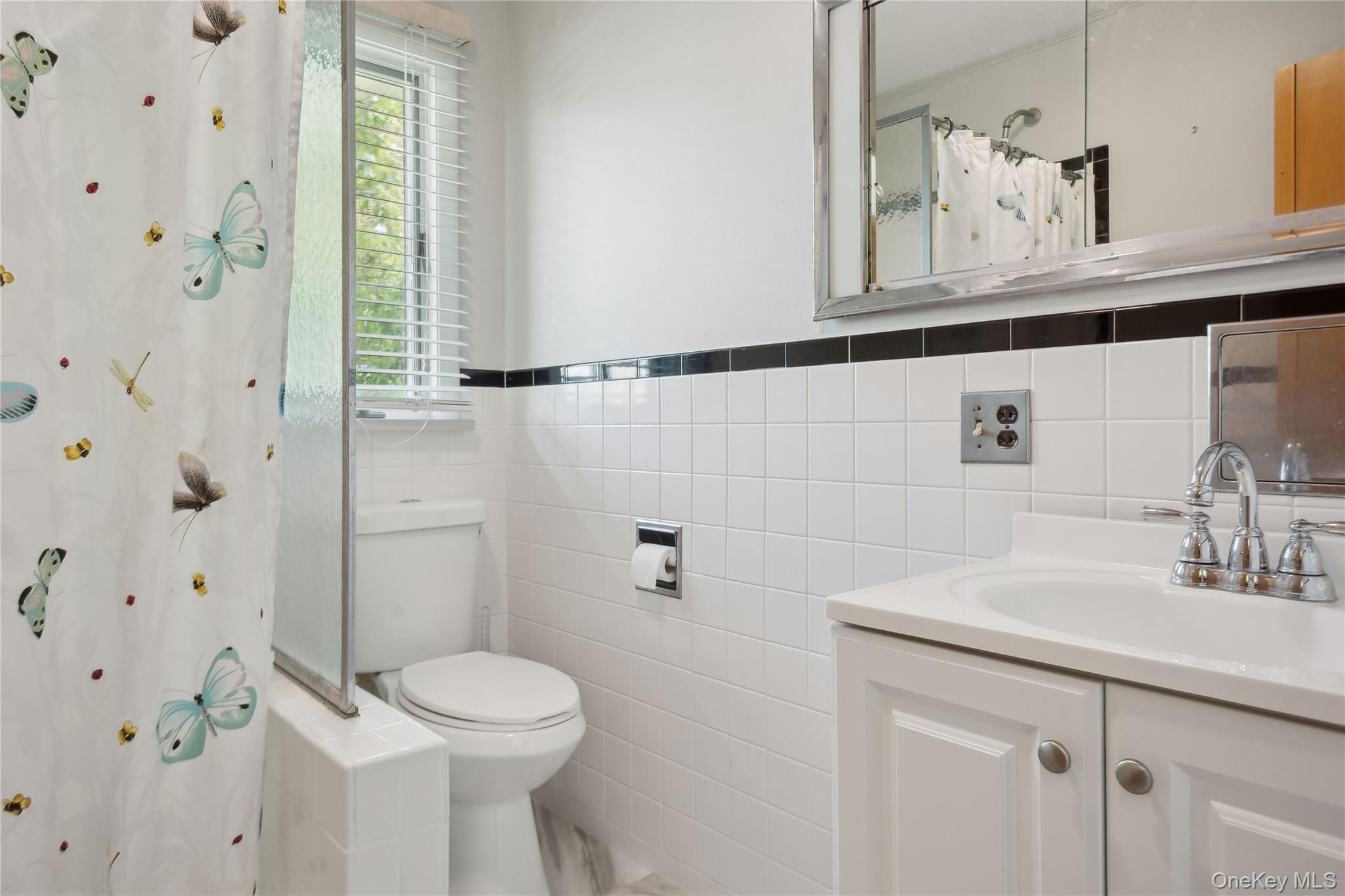 33 Beach Road Laurel, NY 11948 - Photo 18 of 38 a bathroom with a sink a toilet and shower