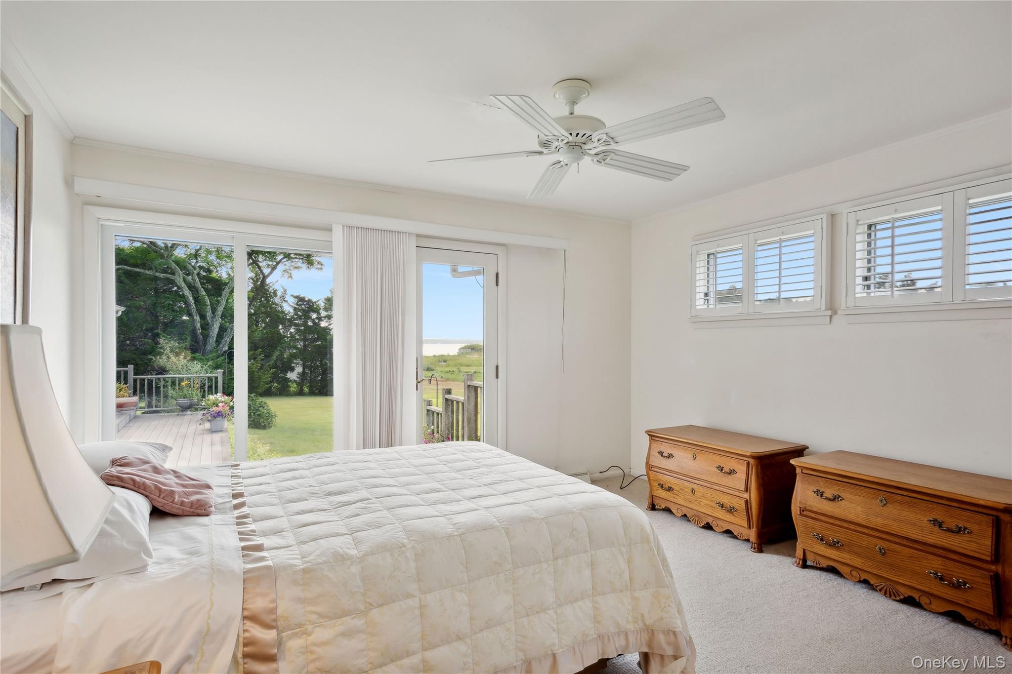 33 Beach Road Laurel, NY 11948 - Photo 20 of 38 a bedroom with a bed and a view of balcony