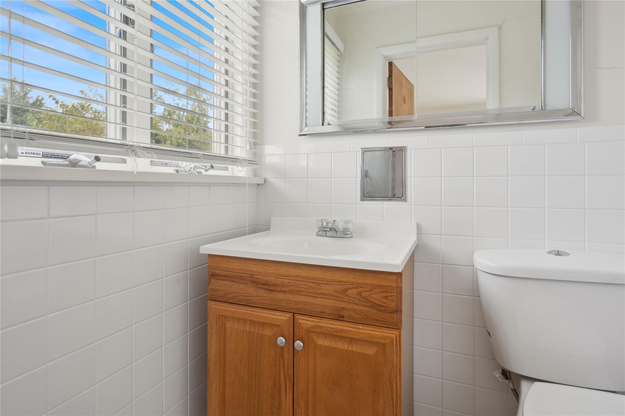 33 Beach Road Laurel, NY 11948 - Photo 21 of 38 a bathroom with a sink and a toilet