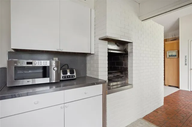 a kitchen with stainless steel appliances a stove a refrigerator and a sink
