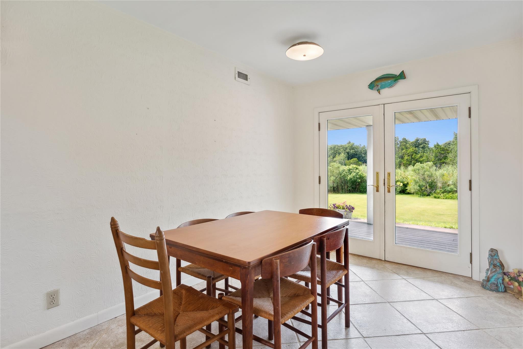 33 Beach Road Laurel, NY 11948 - Photo 25 of 38 a view of a dining table and chairs in a room