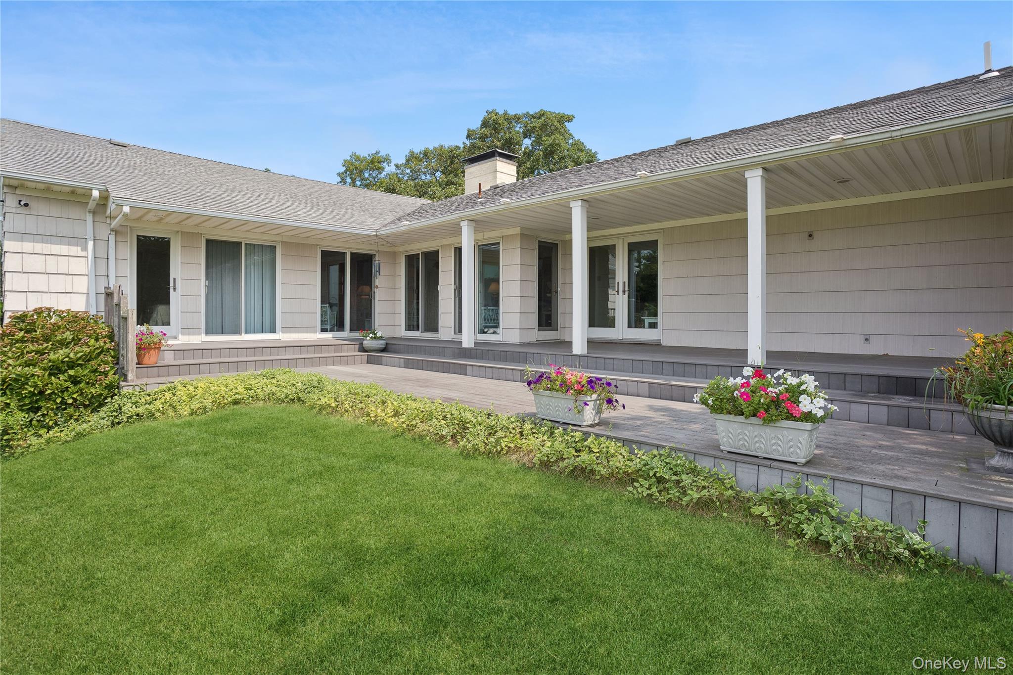 33 Beach Road Laurel, NY 11948 - Photo 28 of 38 front view of a house with a yard
