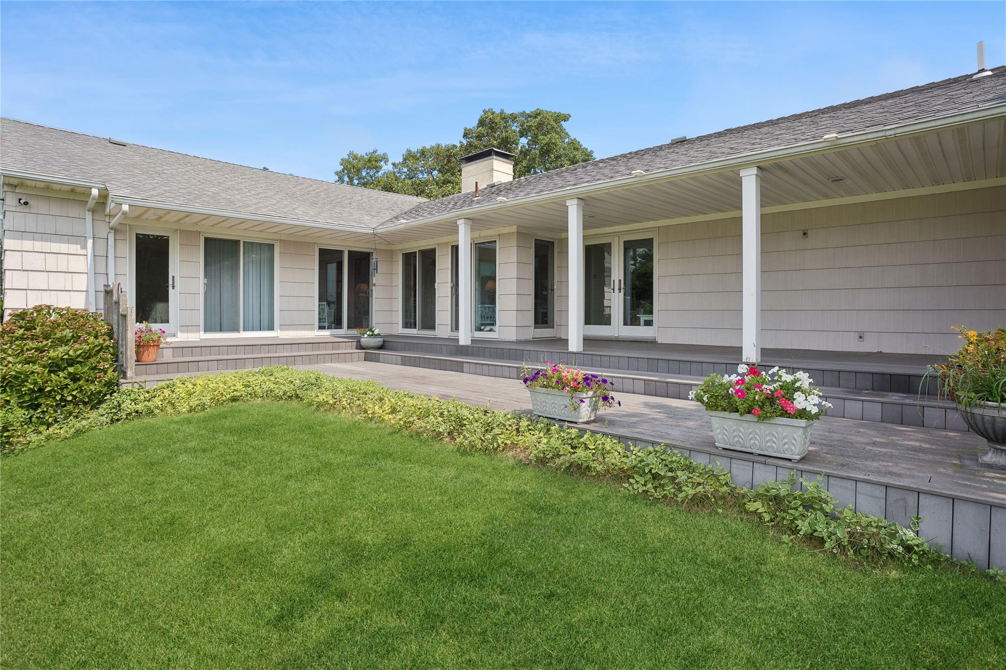 33 Beach Road Laurel, NY 11948 - Photo 28 of 38 front view of a house with a yard