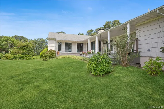 a view of a deck with chair and wooden floor
