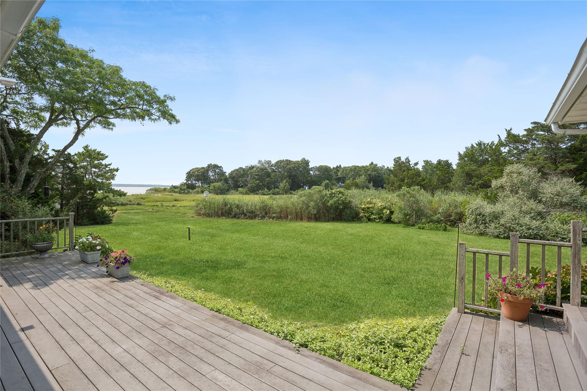 33 Beach Road Laurel, NY 11948 - Photo 30 of 38 a view of a deck with chair and wooden floor