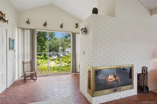 a room with furniture and a fireplace