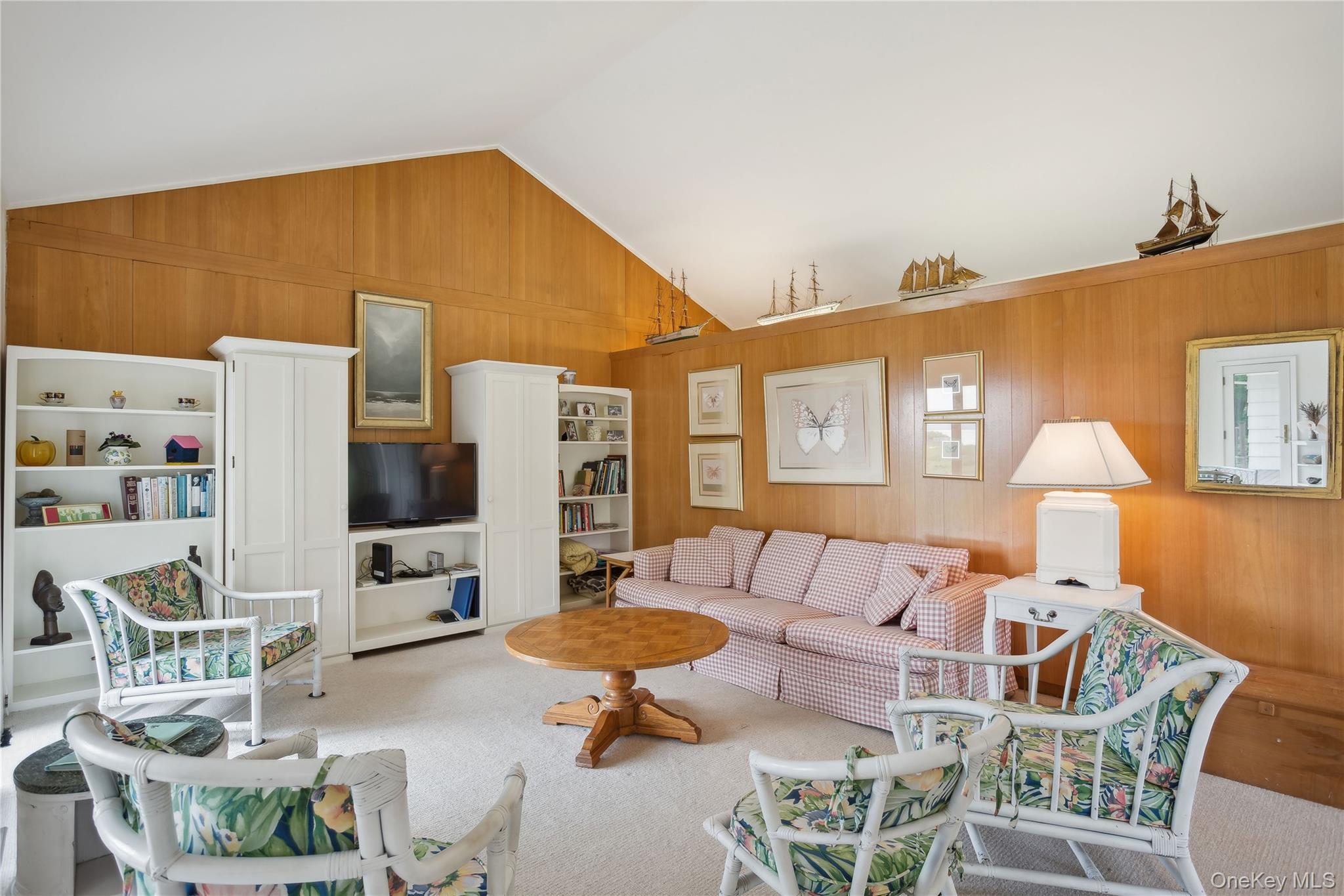 33 Beach Road Laurel, NY 11948 - Photo 5 of 38 a living room with furniture and a flat screen tv