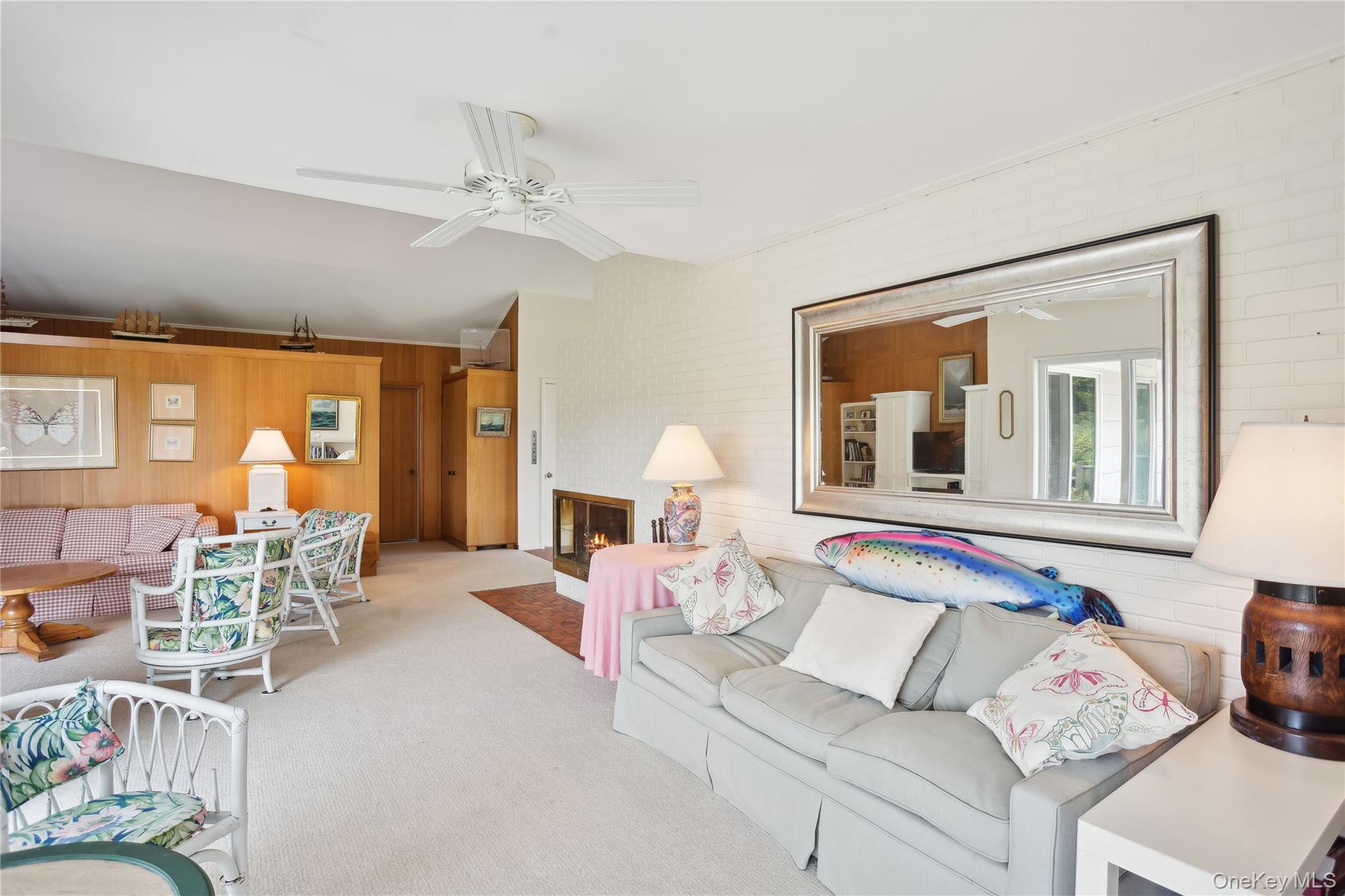 33 Beach Road Laurel, NY 11948 - Photo 7 of 38 a living room with furniture and a large window