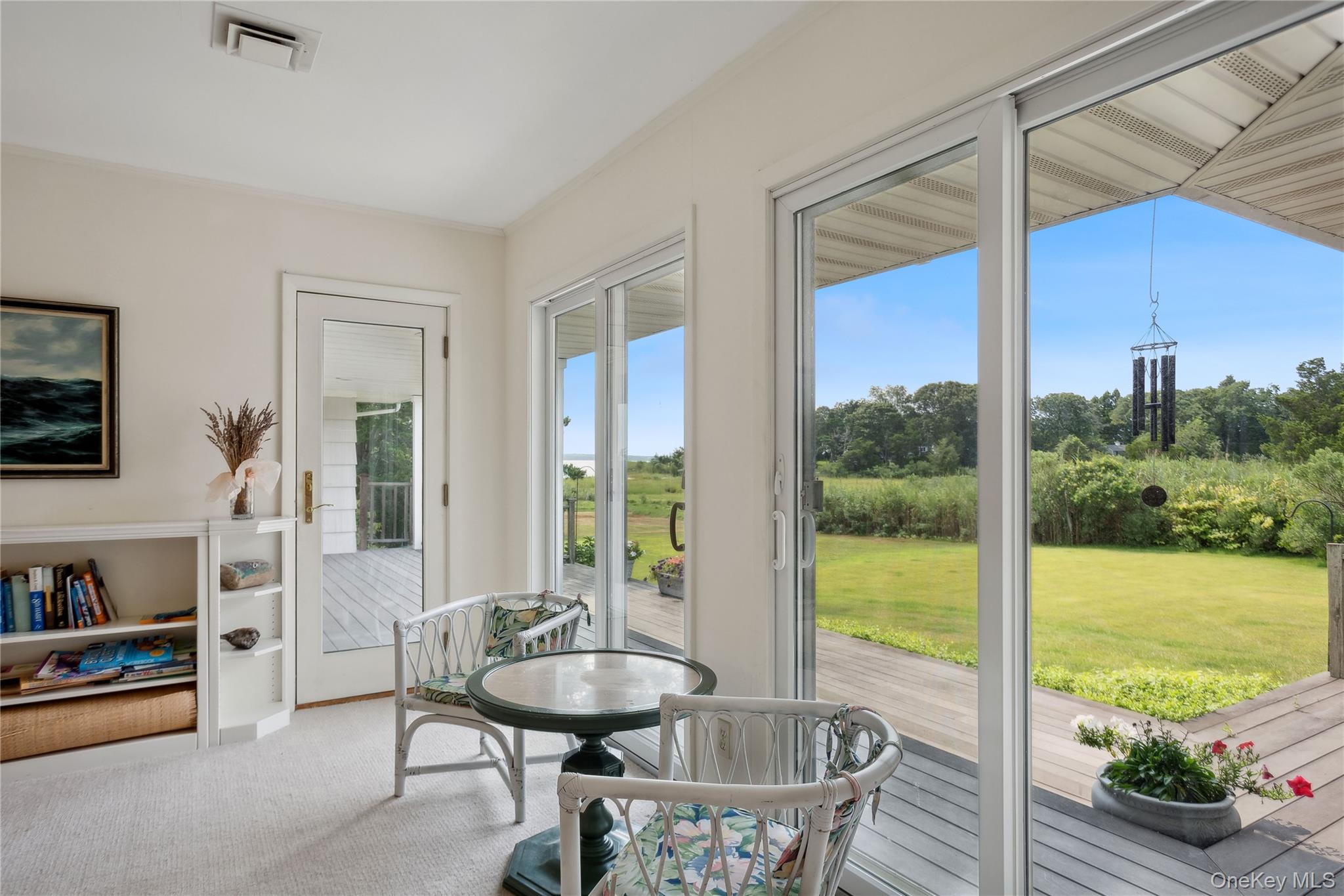 33 Beach Road Laurel, NY 11948 - Photo 10 of 38 a view of a dining room with furniture window and outside view