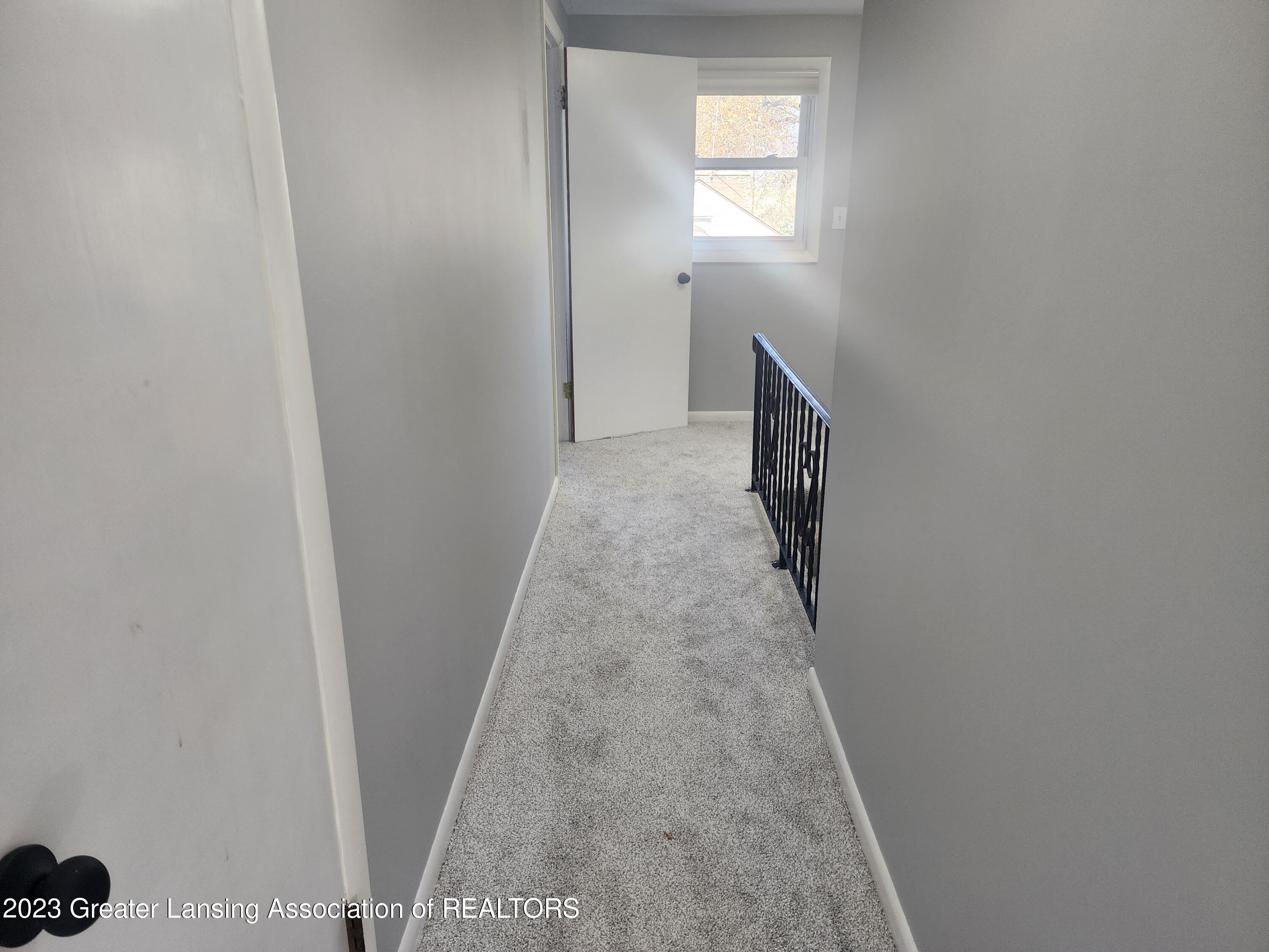 1951 Cumberland Road Lansing, MI 48906 - Photo 25 of 46 Hallway off Primary Bedroom