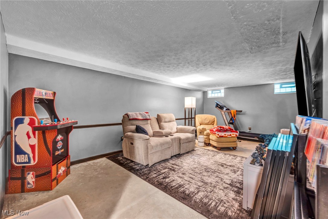2709 Graham Road Stow, OH 44224 - Photo 19 of 28 Living area with concrete floors and a textured ceiling